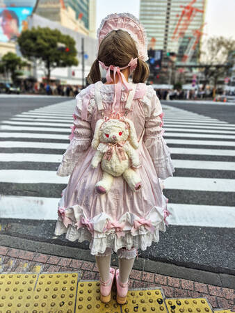 Teenage girl in front of Kanazawa intersection
