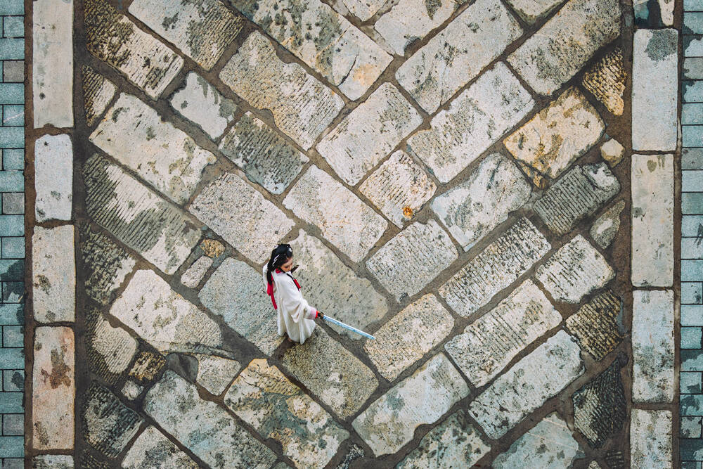 Aerial View of Woman in Traditional Dress on Xian City Wall