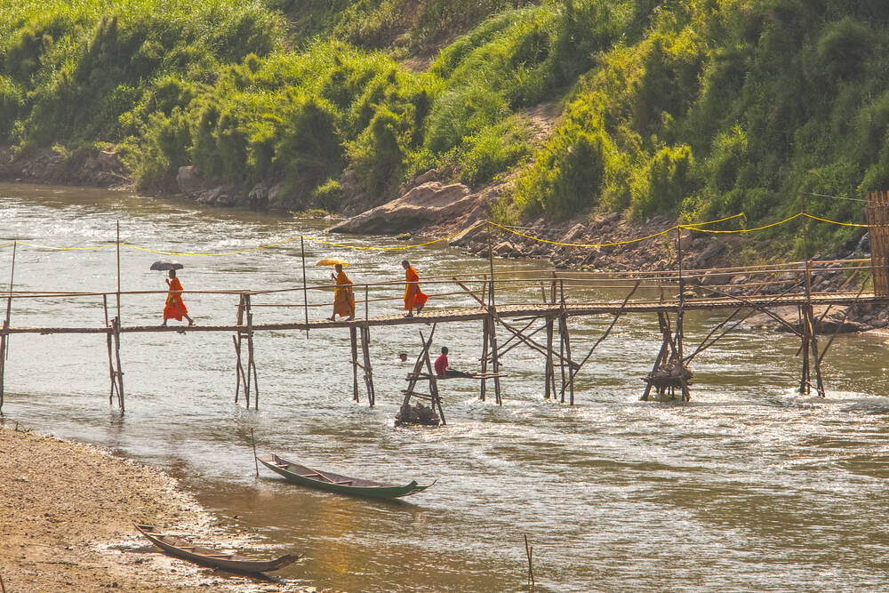 MONKS IN LUANG PRABANG LAOS