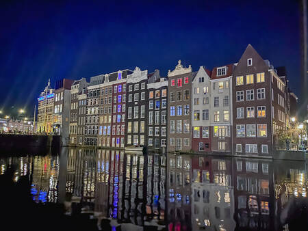 Reflections of the city in Amsterdam's canals