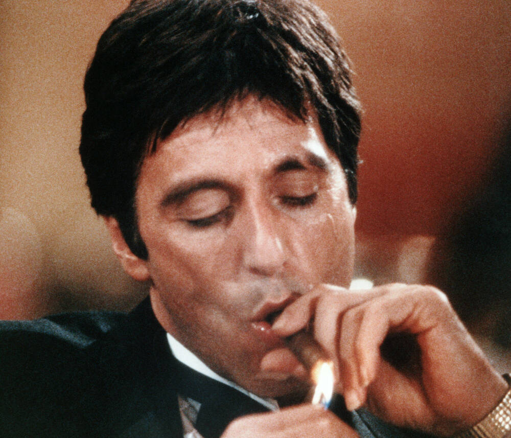 Al Pacino smokes a cigar - Scarface 1983