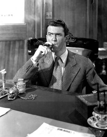 James Stewart smoking a cigar in La Vie est Belle