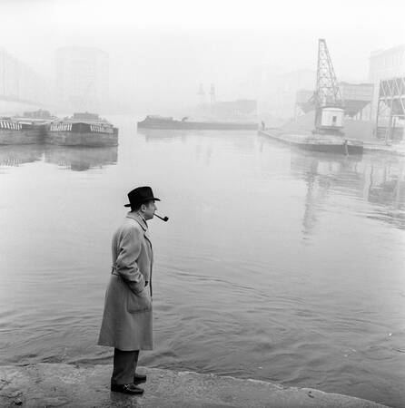 Georges Simenon smoking a pipe by the Navigli in Milan Georges Simenon smoking a pipe by the Navigli in Milan