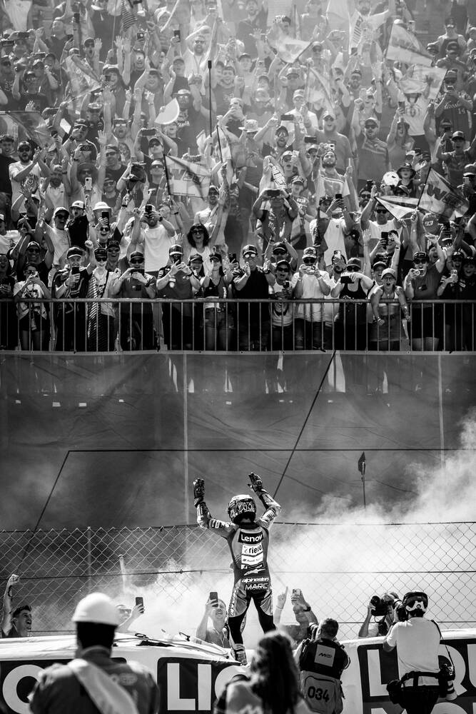 Marc Marquez celebrates with fans