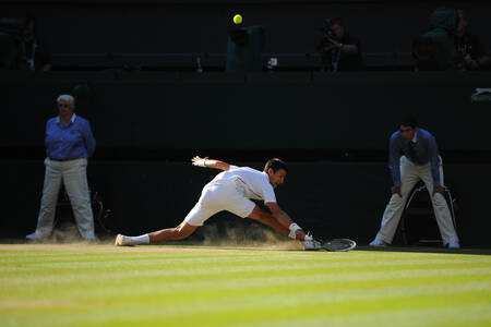 Novak Djokovic - Dusty sliderman Novak Djokovic - Dusty sliderman