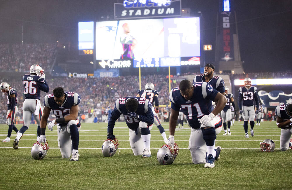 New England Patriots Players in Prayer