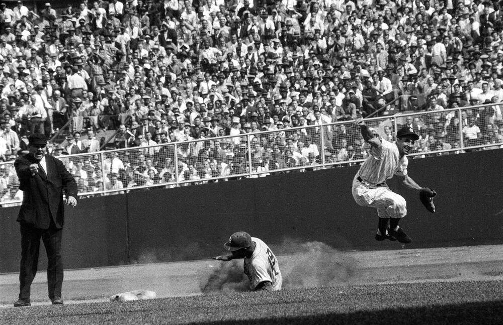Phil Rizzuto completes double play during 1955 World Series at Yankee Stadium